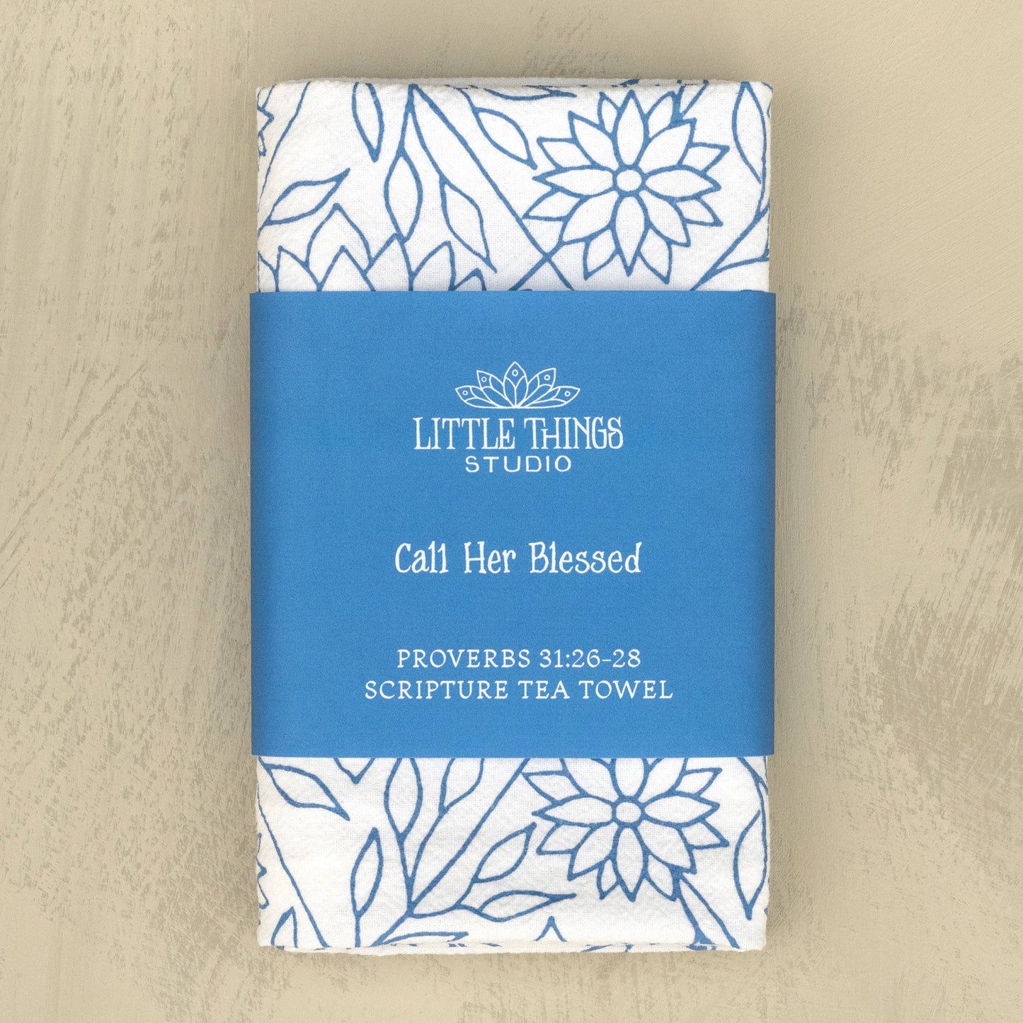 Folded scripture tea towel wrapped in coordinating belly band packaging