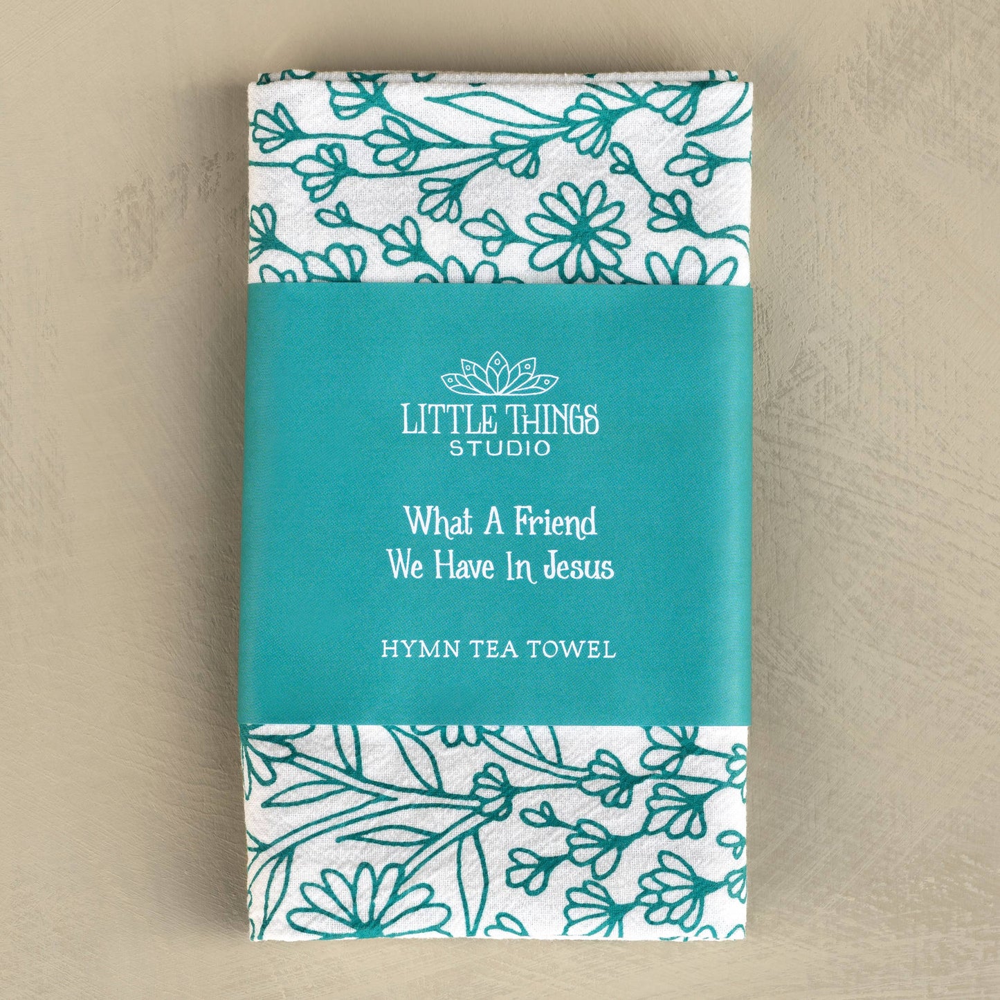 Folded tea towel with belly band displaying hymn title and coordinating art