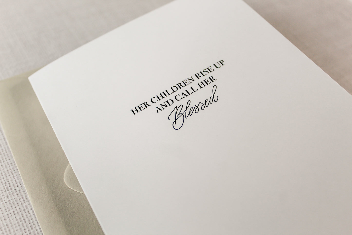 Card reads: "Her Children Rise Up And Call Her Blessed." Each card features digitized hand calligraphy, is printed on a heavy white card stock paper and includes a matching envelope. Cards measure 5.5"x4.25" folded, open horizontally and are blank on the inside.