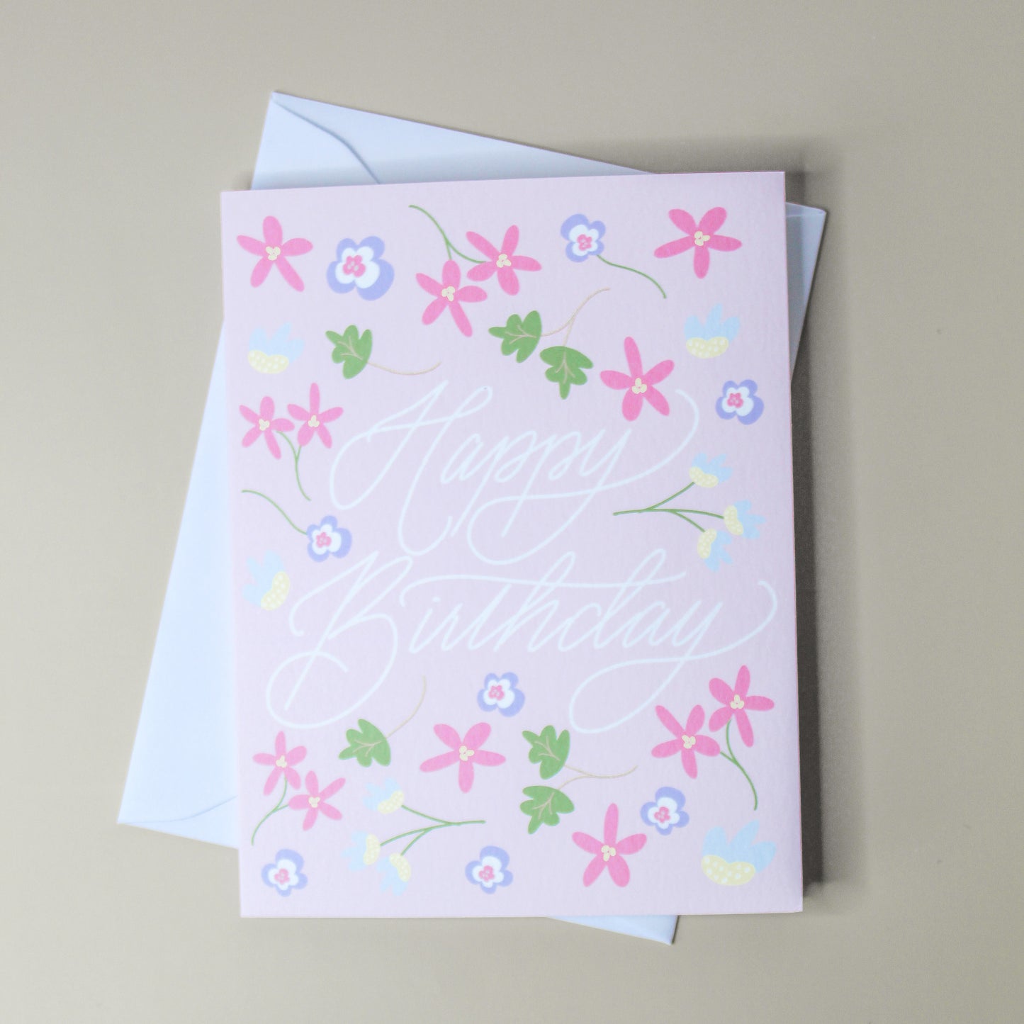 Our "Happy Birthday" card is too cute! Each card is folded to 4.25" tall by 5.5" wide, is blank inside and comes with a matching white envelope. Cards are packaged in cellophane sleeves.