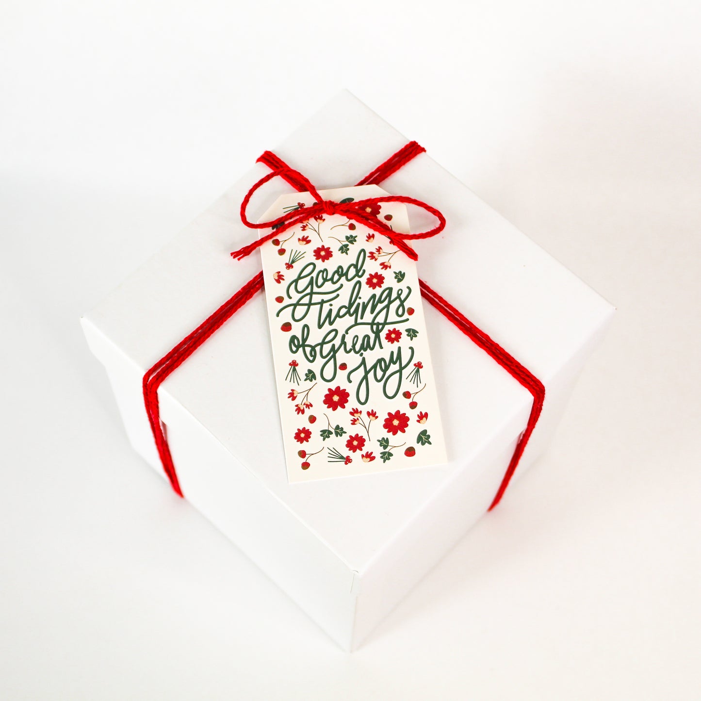 "Good Tidings of Great Joy!" Christmas gift tags add a festive touch to your holiday presents. These cute tags come in sets of eight and include red string.