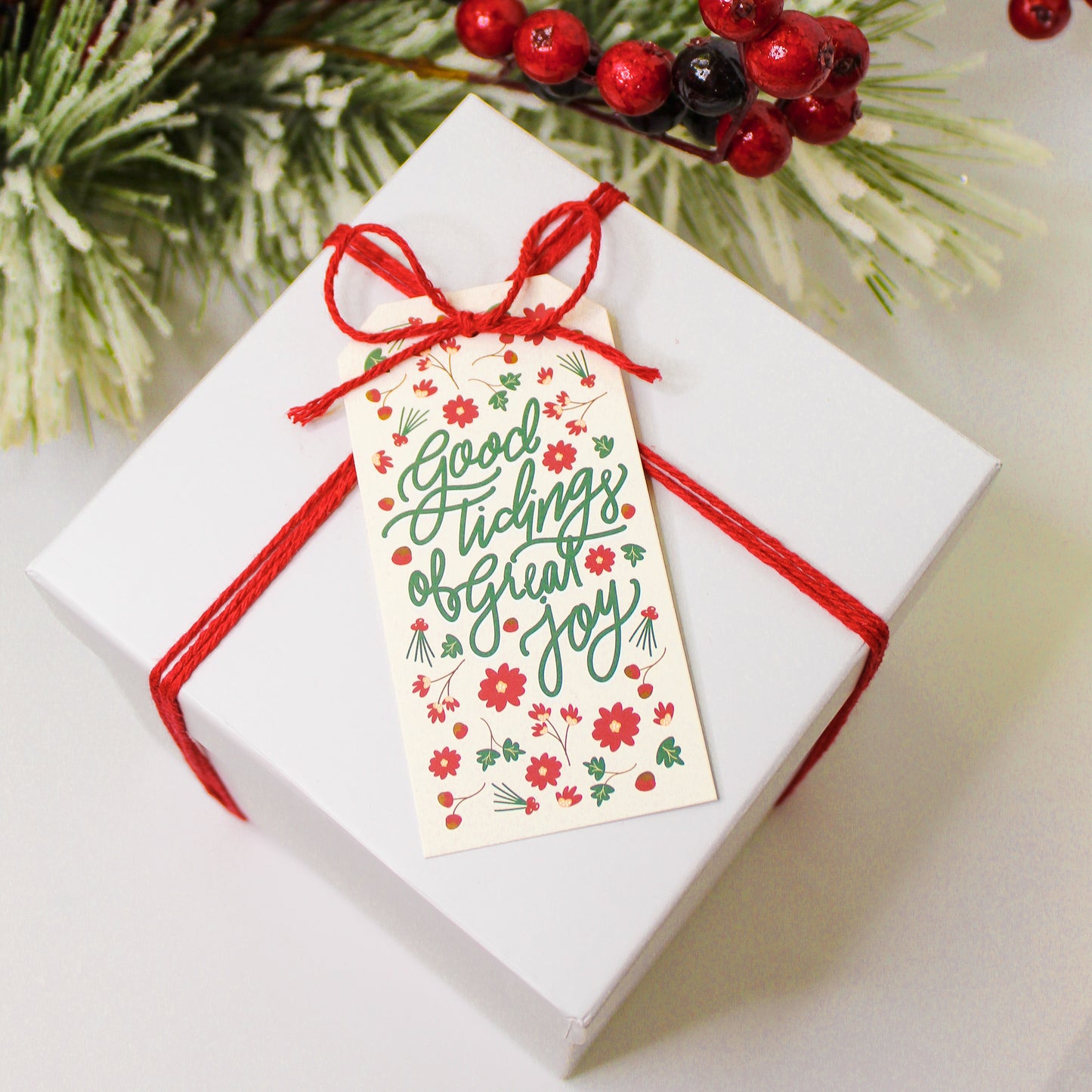 "Good Tidings of Great Joy!" Christmas gift tags add a festive touch to your holiday presents. These cute tags come in sets of eight and include red string.