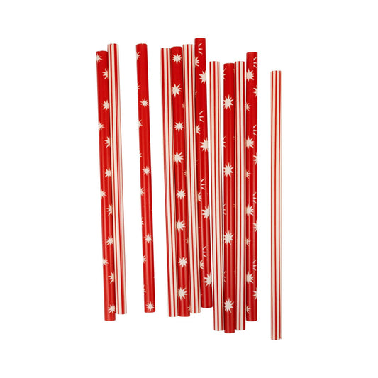 Red christmas straws with white star patterns on a white background