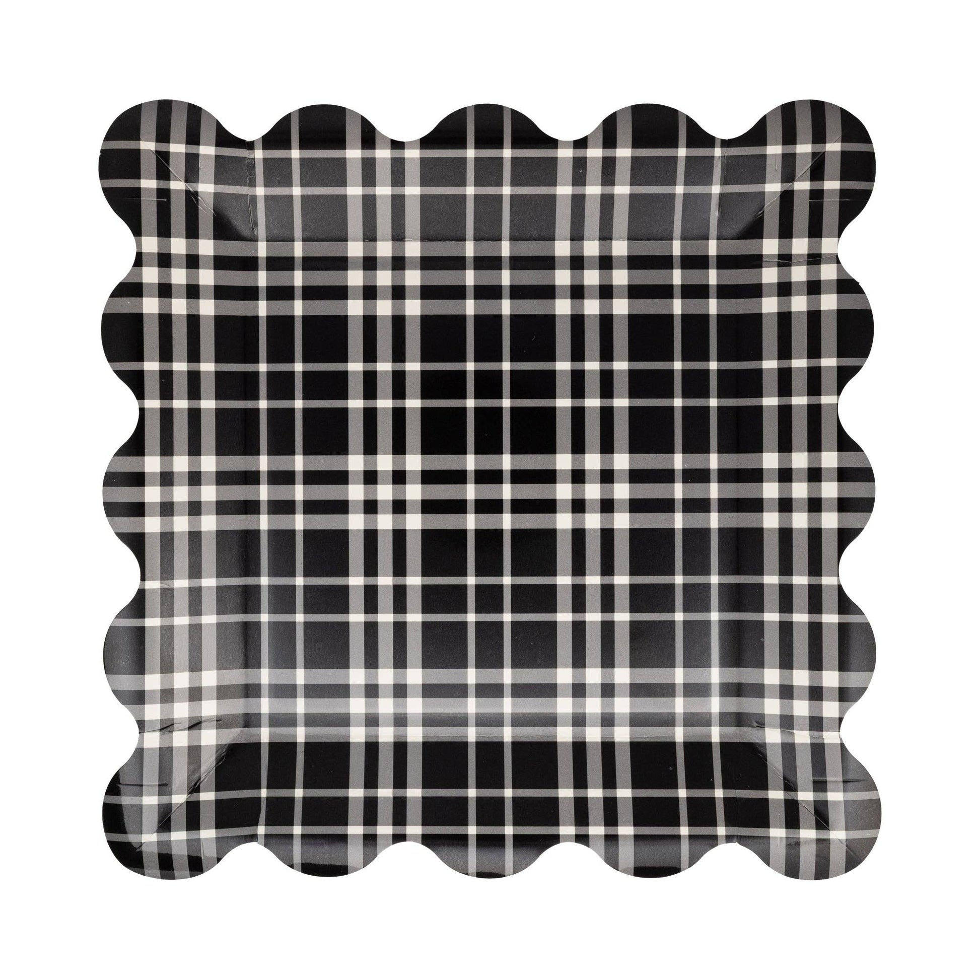 Black and white plaid paper plate with scalloped edge on a white background