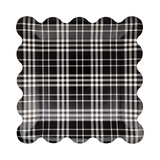 Black and white plaid paper plate with scalloped edge on a white background