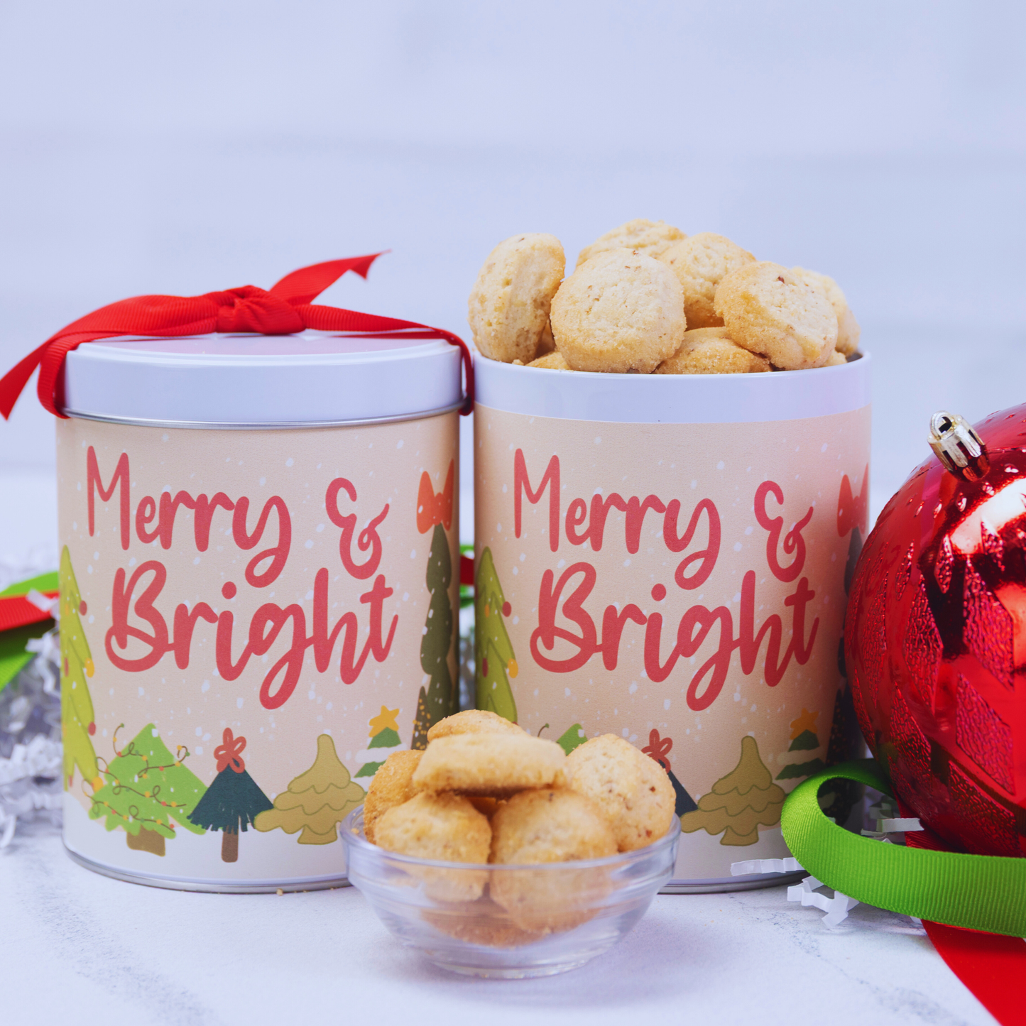 Merry & Bright Christmas gift tin with hand-drawn Christmas trees and Watanut cheddar shortbread cookies