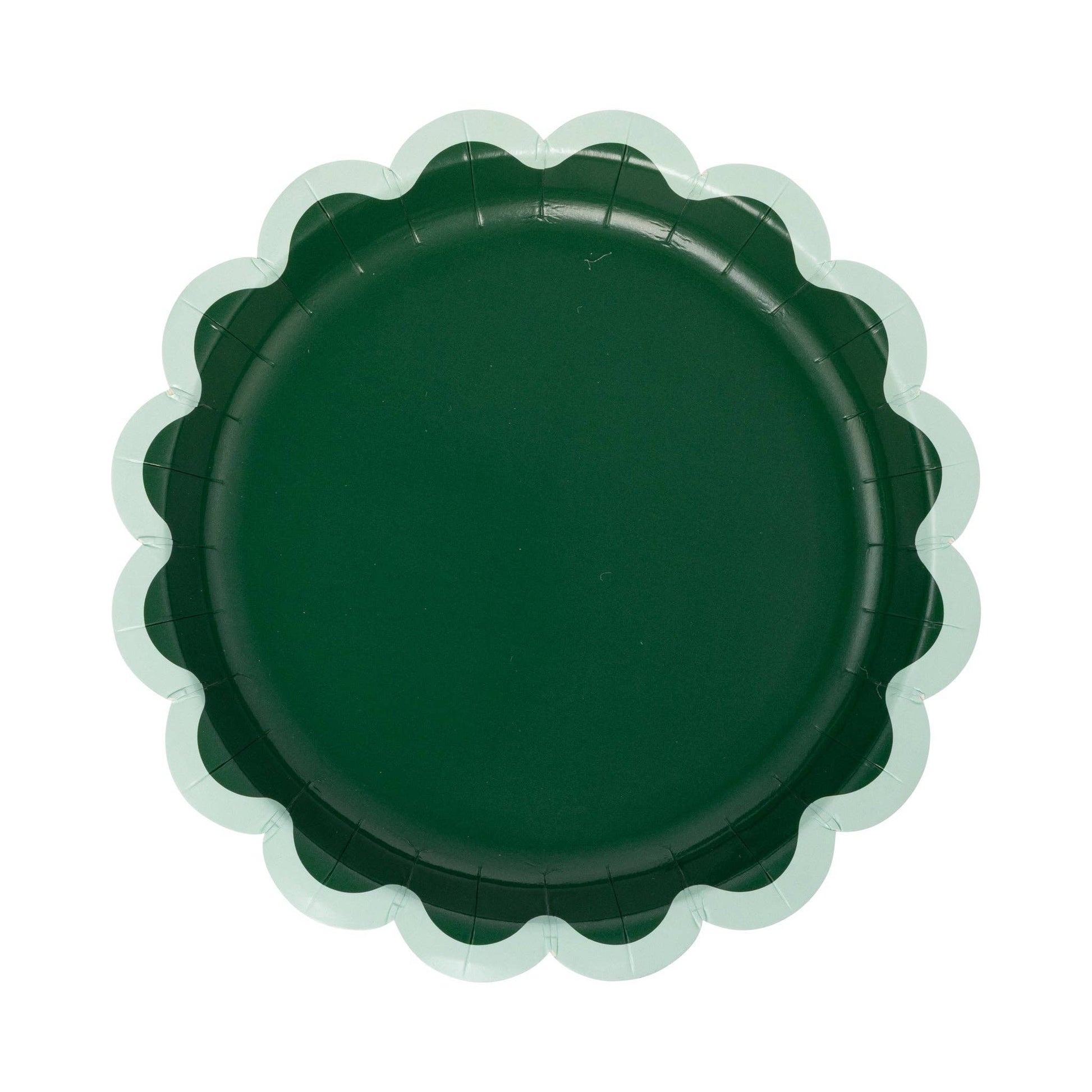 Green scalloped-edge plate on a white background