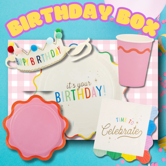 birthday party box with rainbow plates, felt crown, cups, and napkins