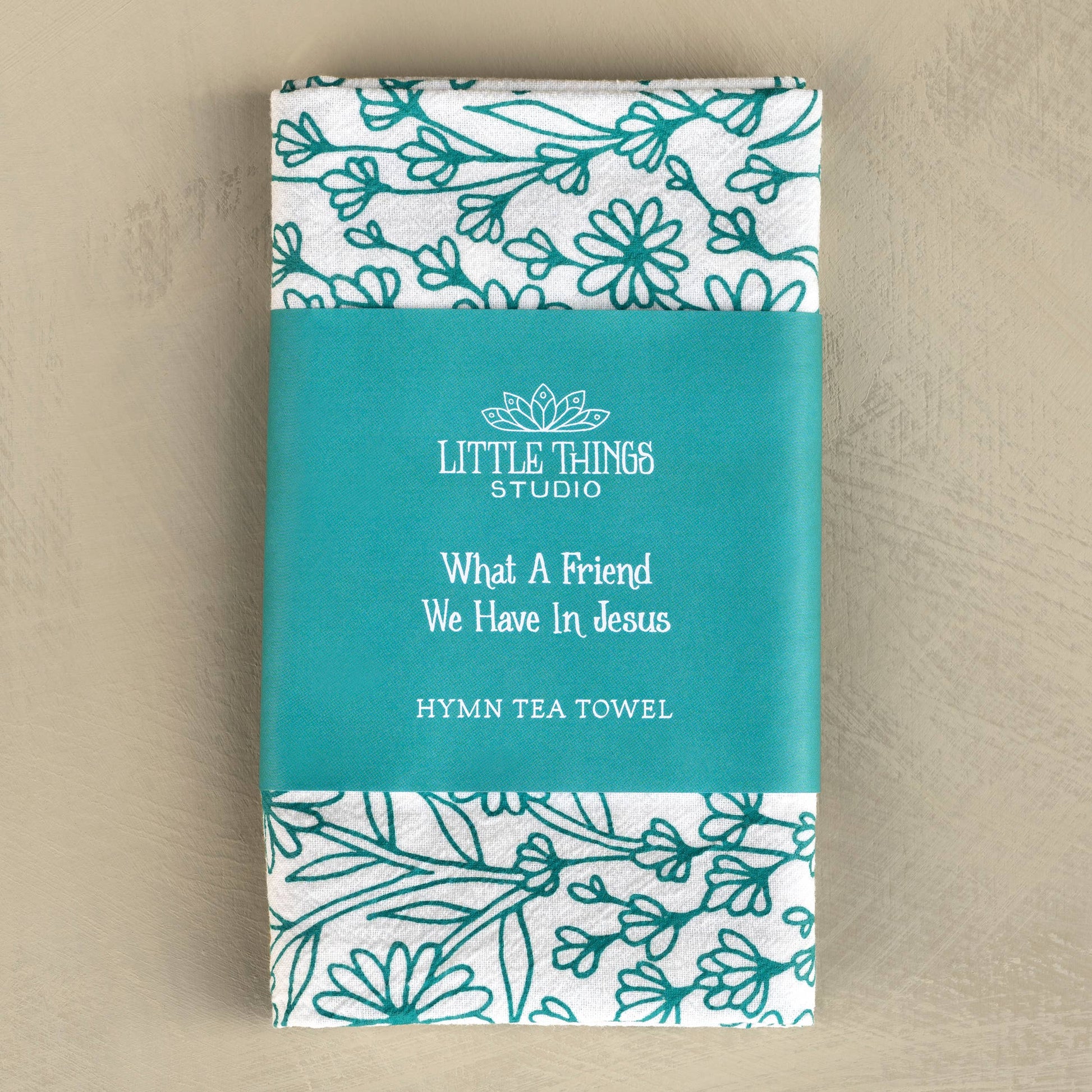 Folded tea towel with belly band displaying hymn title and coordinating art
