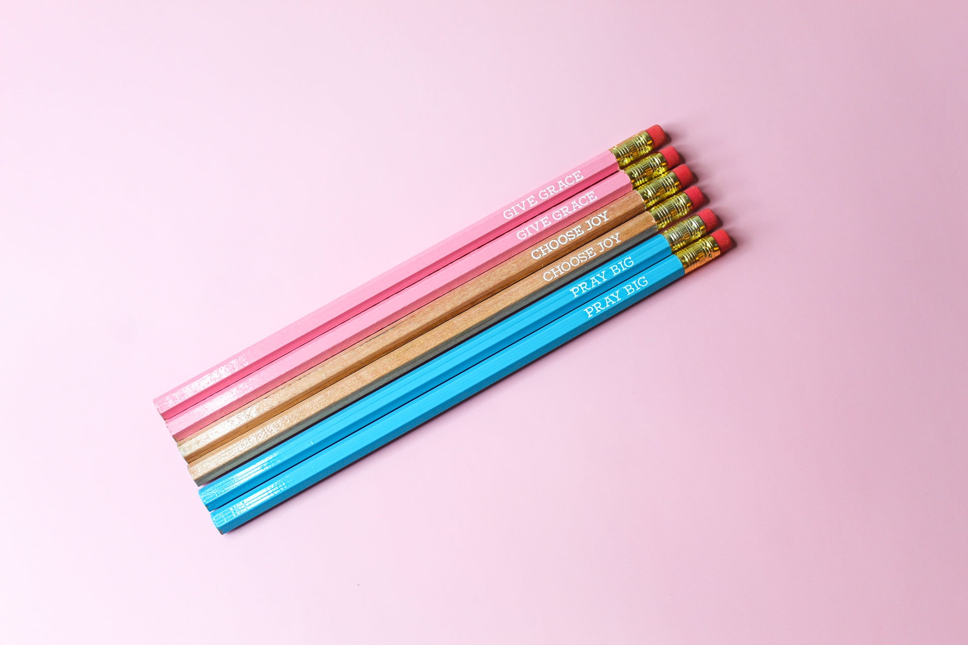 Give Grace, Choose Joy, Pray Big Pencil Set is a hopeful Pencil Set that has six pencils: two pink pencils imprinted with "give grace", two natural wood pencils imprinted with "choose joy" and two blue pencils imprinted with "pray big. 
