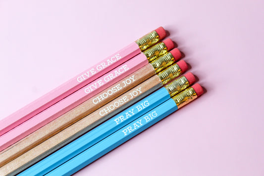 Give Grace, Choose Joy, Pray Big Pencil Set is a hopeful Pencil Set that has six pencils: two pink pencils imprinted with "give grace", two natural wood pencils imprinted with "choose joy" and two blue pencils imprinted with "pray big. 