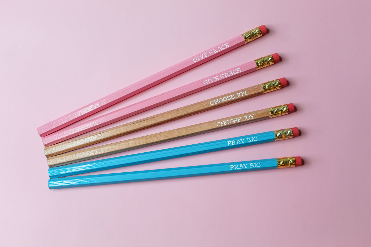 Give Grace, Choose Joy, Pray Big Pencil Set is a hopeful Pencil Set that has six pencils: two pink pencils imprinted with "give grace", two natural wood pencils imprinted with "choose joy" and two blue pencils imprinted with "pray big. 