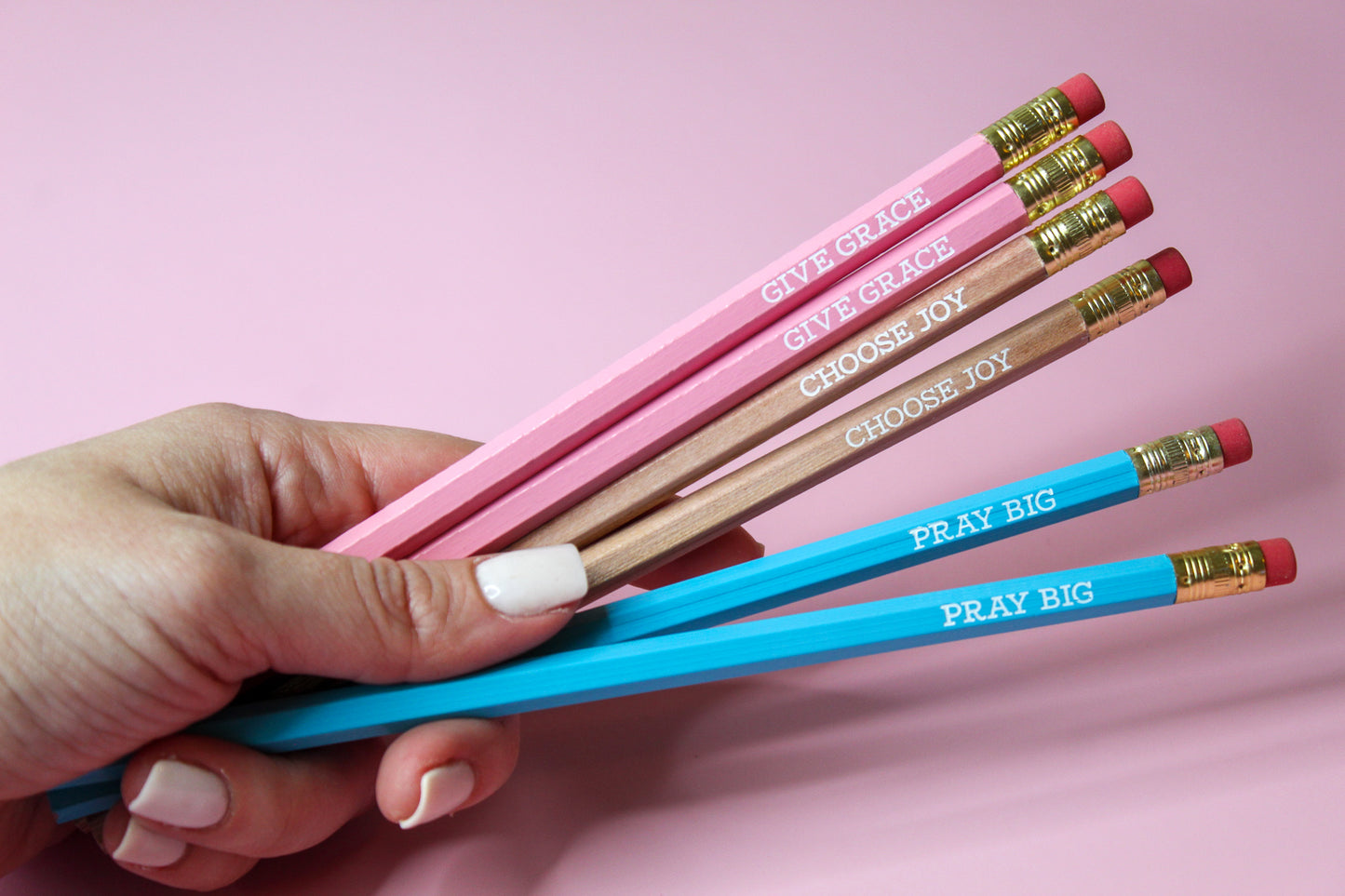 Give Grace, Choose Joy, Pray Big Pencil Set is a hopeful Pencil Set that has six pencils: two pink pencils imprinted with "give grace", two natural wood pencils imprinted with "choose joy" and two blue pencils imprinted with "pray big. 