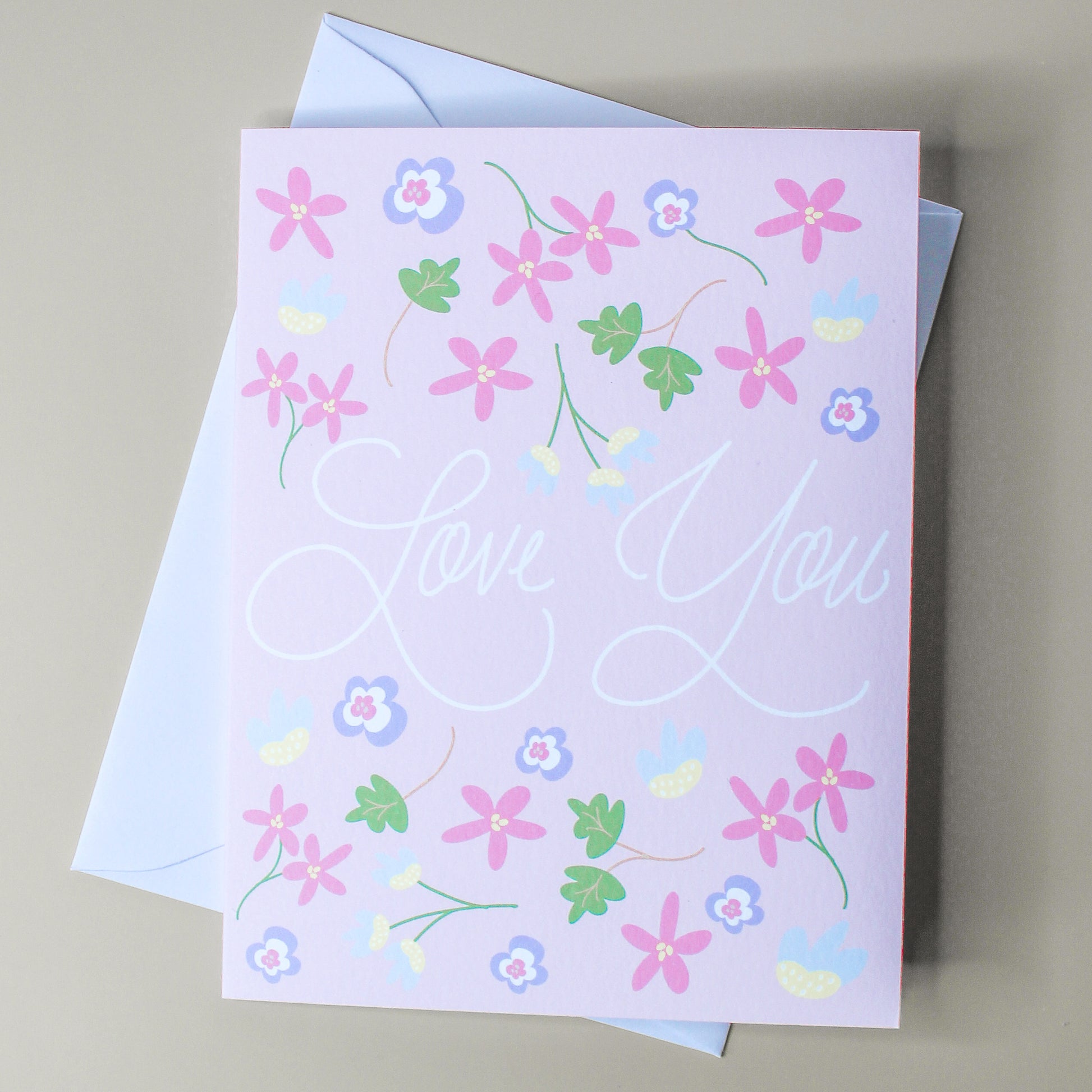Our "Love You" card is the perfect card for an anniversary, wedding, valentines day - or a "just because" card! Each card is folded to 4.25" tall by 5.5" wide, is blank inside and comes with a matching white envelope. Cards are packaged in cellophane sleeves.