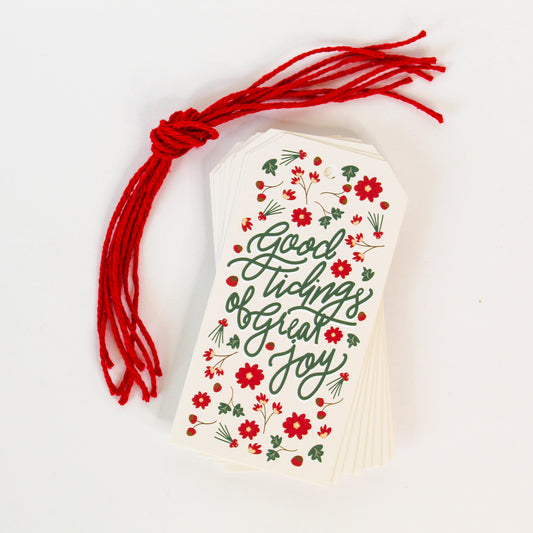 "Good Tidings of Great Joy!" Christmas gift tags add a festive touch to your holiday presents. These cute tags come in sets of eight and include red string. 