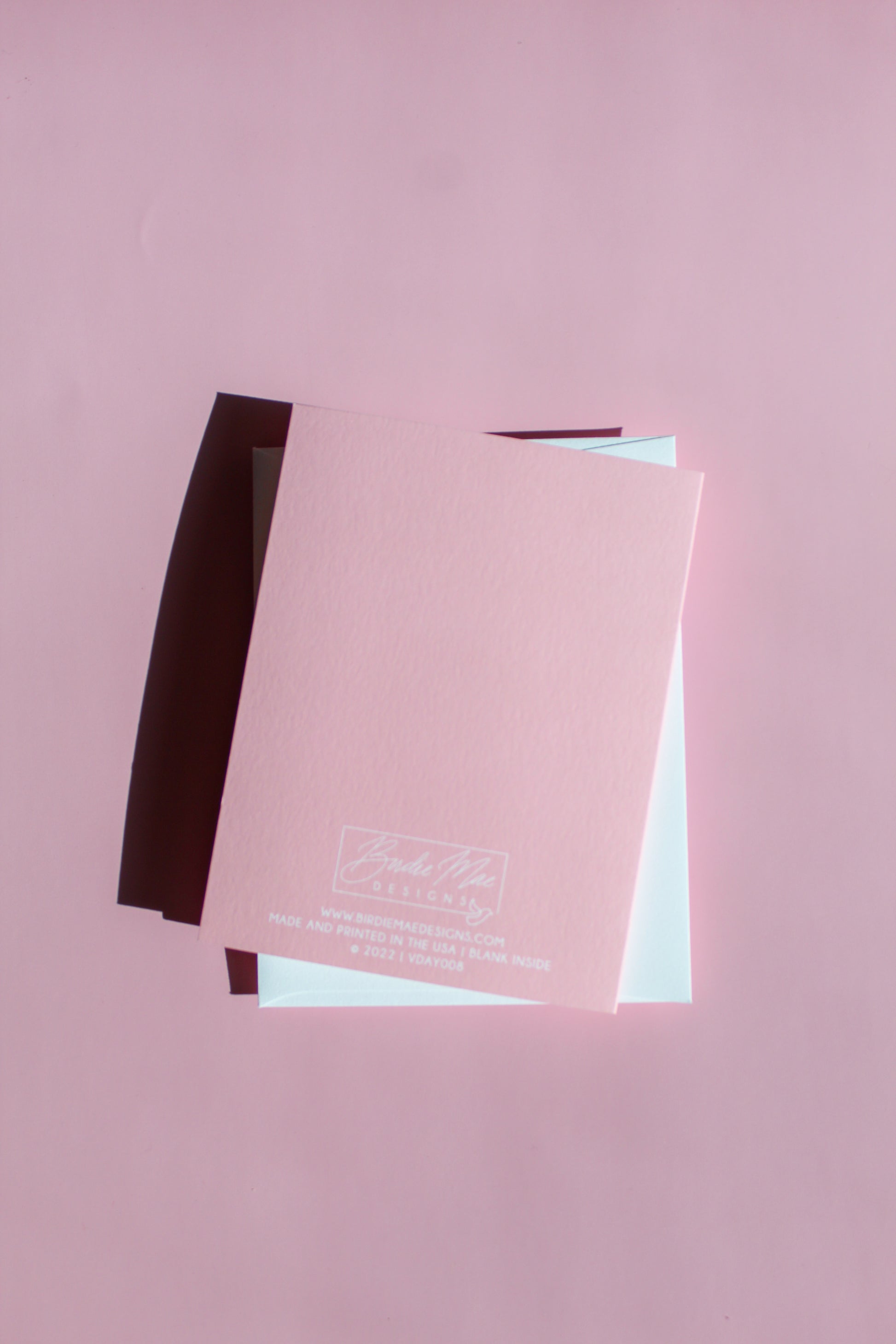 Our "Happy Valentine's Day, Love Bug!" Valentine's Day card features hand drawn lady bugs on a pink background - it is perfect for a kid or adult! Each card is folded to 4.25" tall by 5.5" wide, is blank inside and comes with a matching white envelope. Cards are packaged in cellophane sleeves.