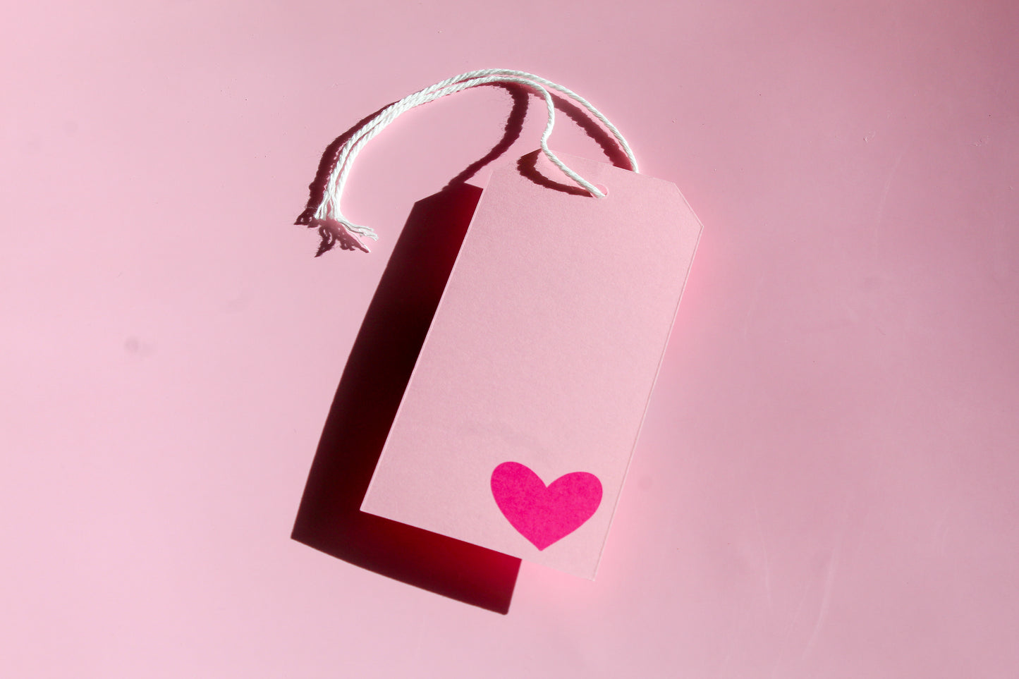 "Love You, Mean It!" Valentine tags come in sets of eight and include white string. 